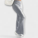 Grey ribbed knit flared pants, side view with vertical seam detail