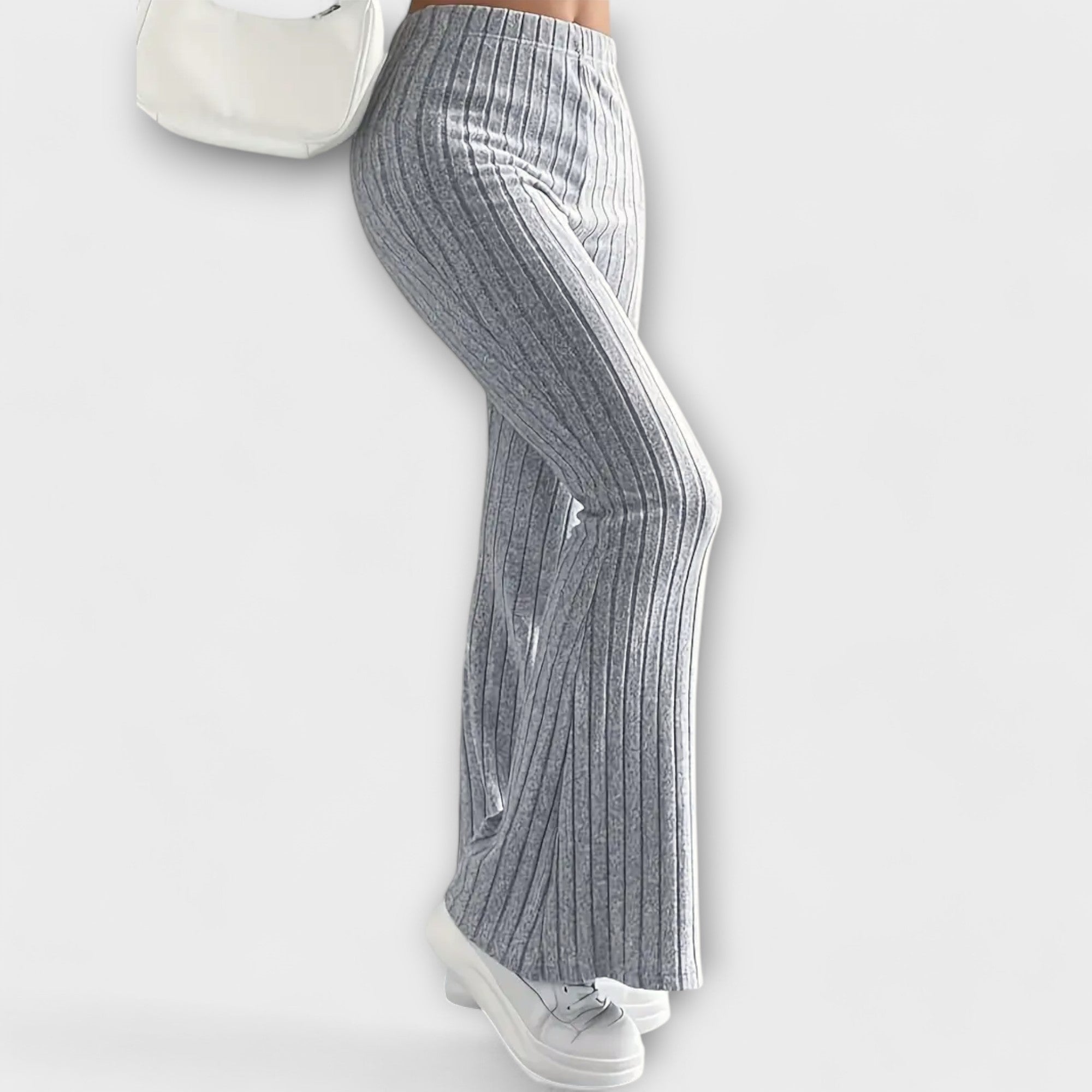 Grey ribbed knit flared pants, side view with vertical seam detail