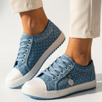 Light blue floral-pattern low-top lace-up sport sneakers with white rubber toe