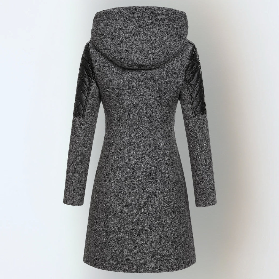 Women’s winter parka coat in dark gray with hood and quilted black sleeves, back view