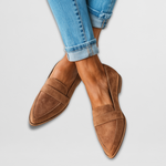 Brown suede leather moccasin loafers with side strap and pointed toe.