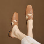 Tan natural leather mule flats, side-by-side view with low block heel and cutout strap