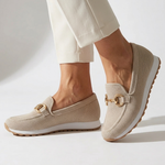 Beige orthopedic moccasin shoes with gold-tone horsebit detail and cushioned sole