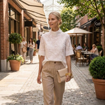 Women's pale floral short-sleeve blouse with high crew neck