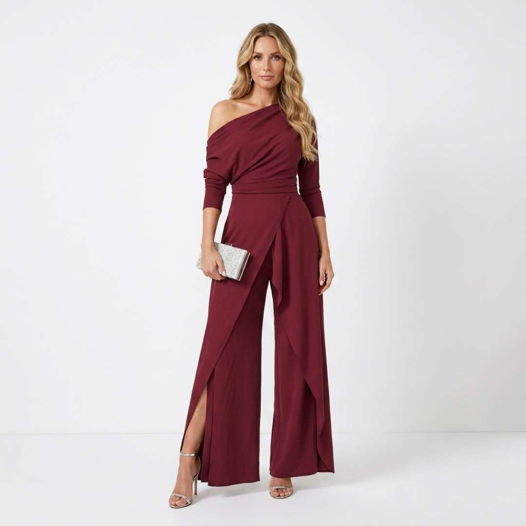 Burgundy one-shoulder jumpsuit with long sleeves and flowing wide-leg panels