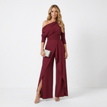 Burgundy one-shoulder jumpsuit with long sleeves and flowing wide-leg panels