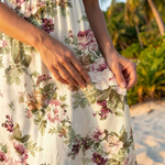 Floral print fabric close-up for vintage midi dress, cream ground with pink roses and green leaves