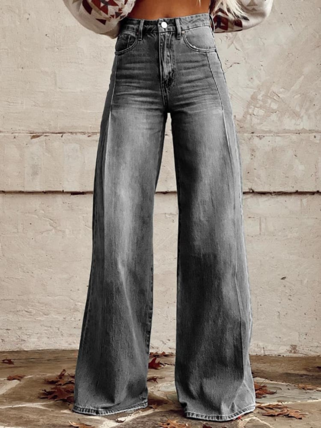 Gray wide-leg denim pants with high waist and front button fly