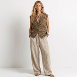 Women’s patterned sleeveless vest with wide-leg linen pants in natural beige