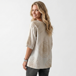 Vintage casual blouse back view, off-white with circular embroidery pattern and loose fit
