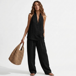 Two-piece V-neck linen set with sleeveless top and wide-leg pants in black.