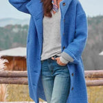 Long blue hooded coat with button front and side pockets