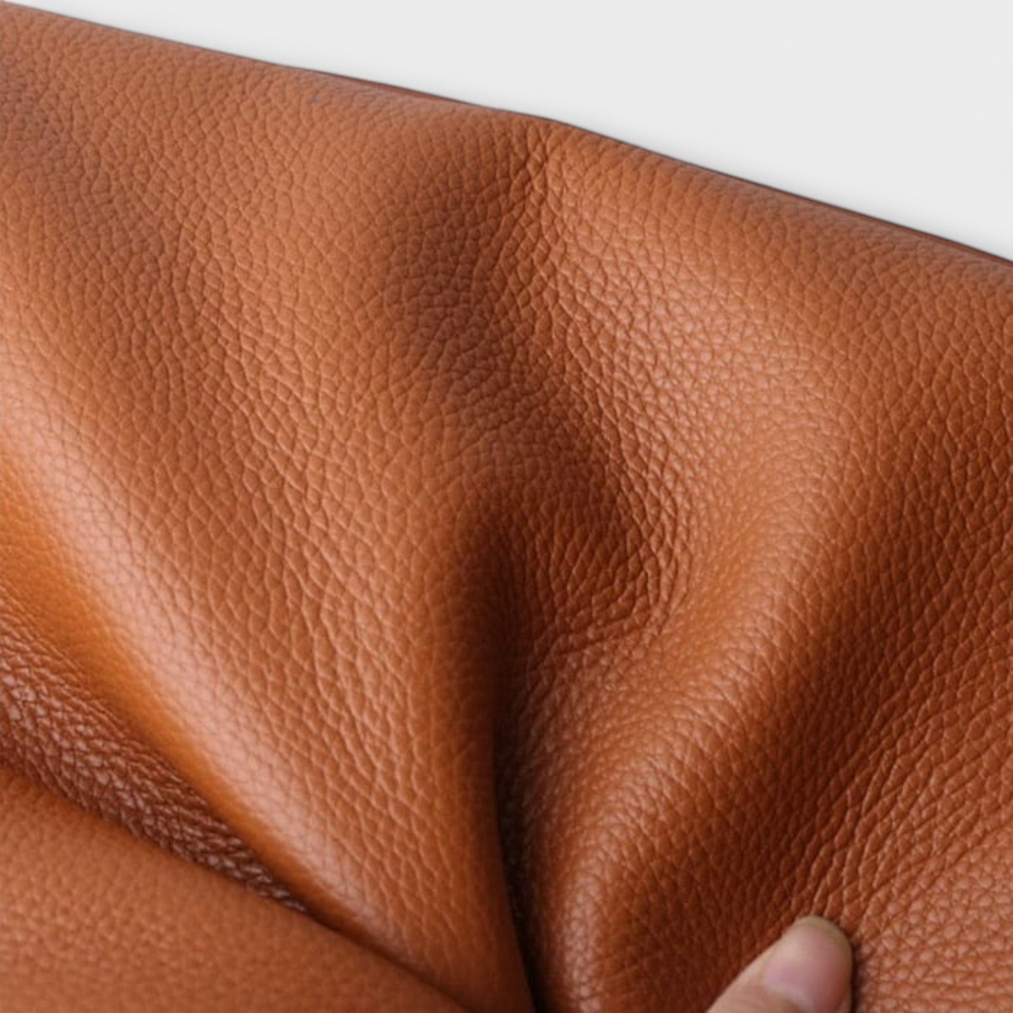 Close-up of tan brown pebbled natural leather texture