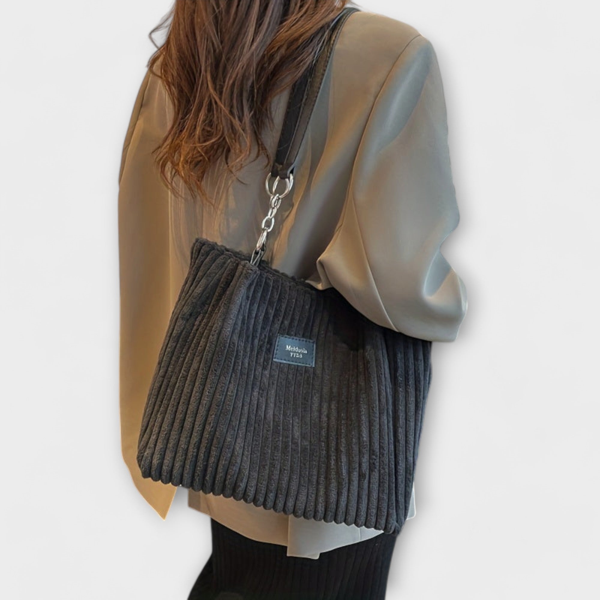 Charcoal ribbed shoulder bag with chain strap, worn on model