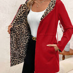 Red reversible hooded jacket with leopard lining, zip front and side pocket