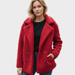 Red sherpa puffer jacket with wide lapels, double button front, and long sleeves