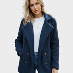 Navy sherpa puffer jacket with wide lapels, double-breasted buttons, and long sleeves