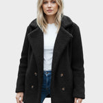 Black sherpa puffer jacket with wide lapels, double button front, and long sleeves