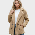 Tan sherpa puffer jacket with wide lapels, double-breasted buttons, and long sleeves