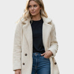 Light beige sherpa puffer jacket with wide lapels, double-breasted buttons, and long sleeves