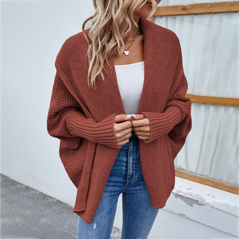 Brown knit cardigan with open front and long sleeves, textured waffle weave.