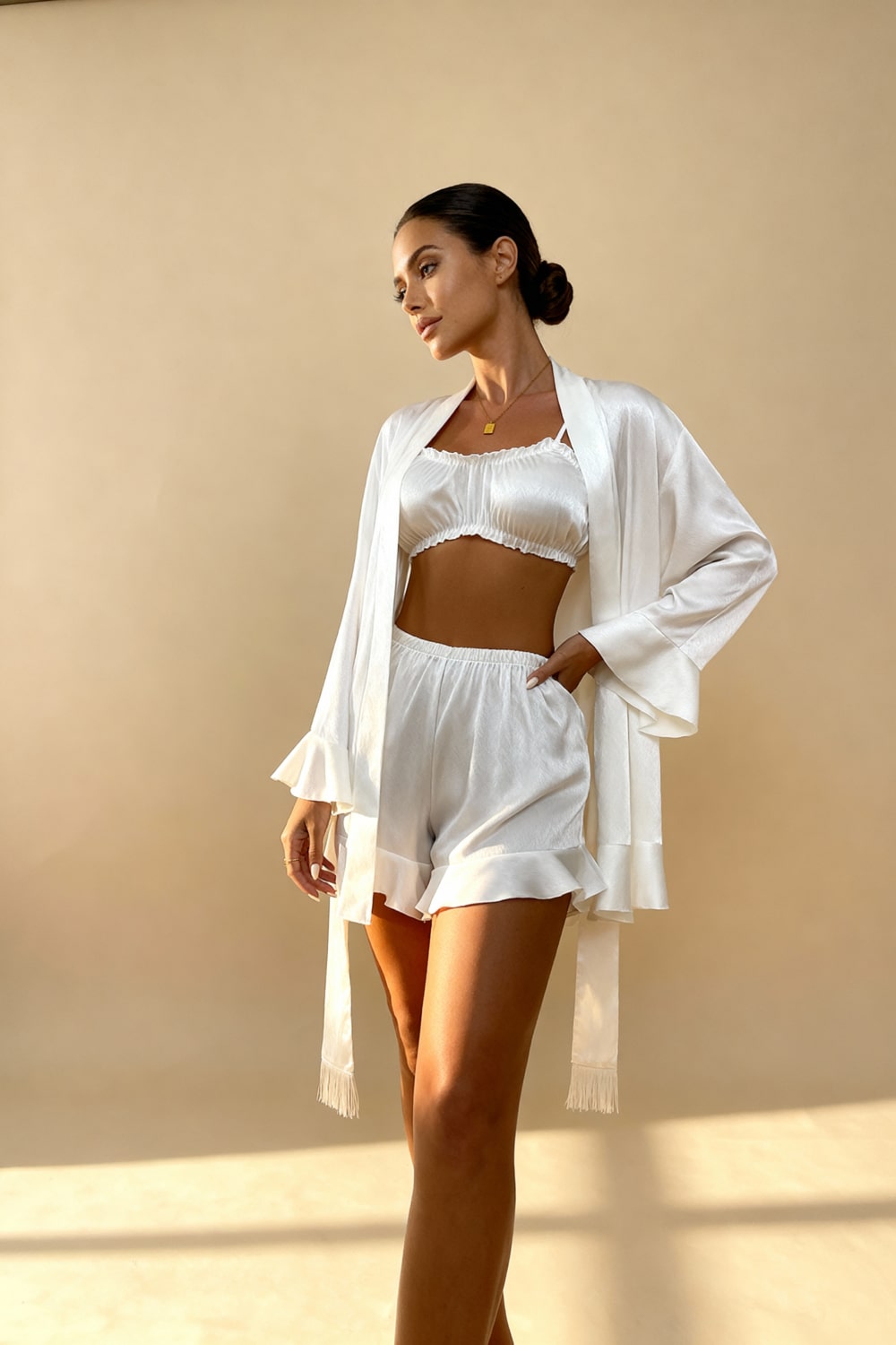 Angie satin pajama set in white: cropped camisole, ruffle shorts, and belted robe