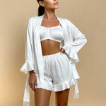 Angie satin pajama set in white: cropped camisole, ruffle shorts, and fringe robe
