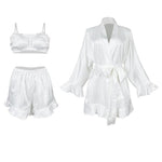 Angie satin pajama set flat lay: cropped camisole, ruffle shorts, and robe