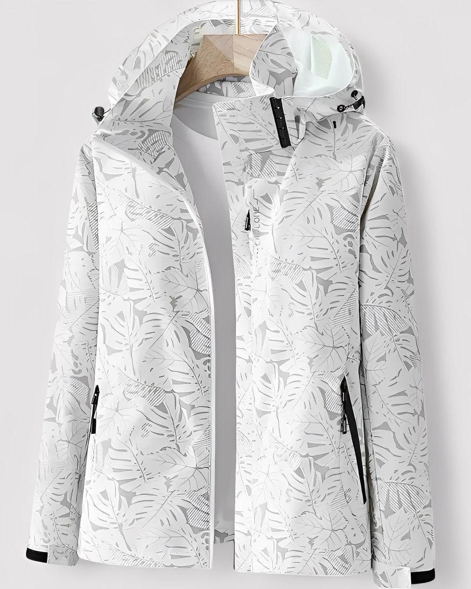 White hooded jacket with full-zip and leaf pattern, black-trim zip pockets