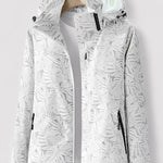 White hooded jacket with full-zip and leaf pattern, black-trim zip pockets