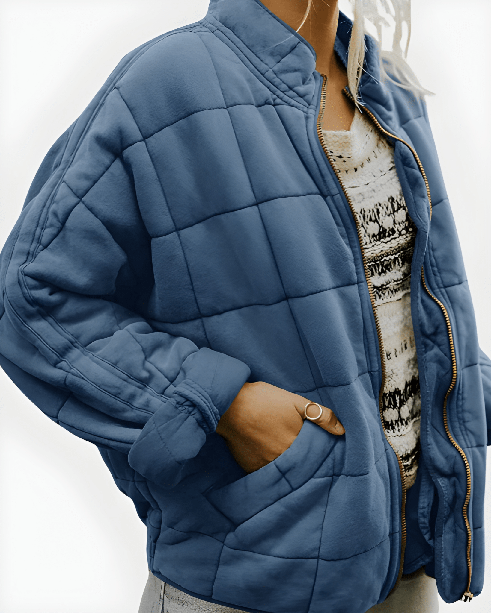 Blue quilted puffer jacket with full-zip front and side pockets, stand collar.