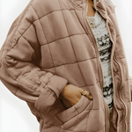 Beige/tan quilted puffer jacket, full-zip front and side pockets, stand collar.