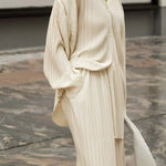 Beige pinstripe long-sleeve top and matching wide-leg pants in oversized fit