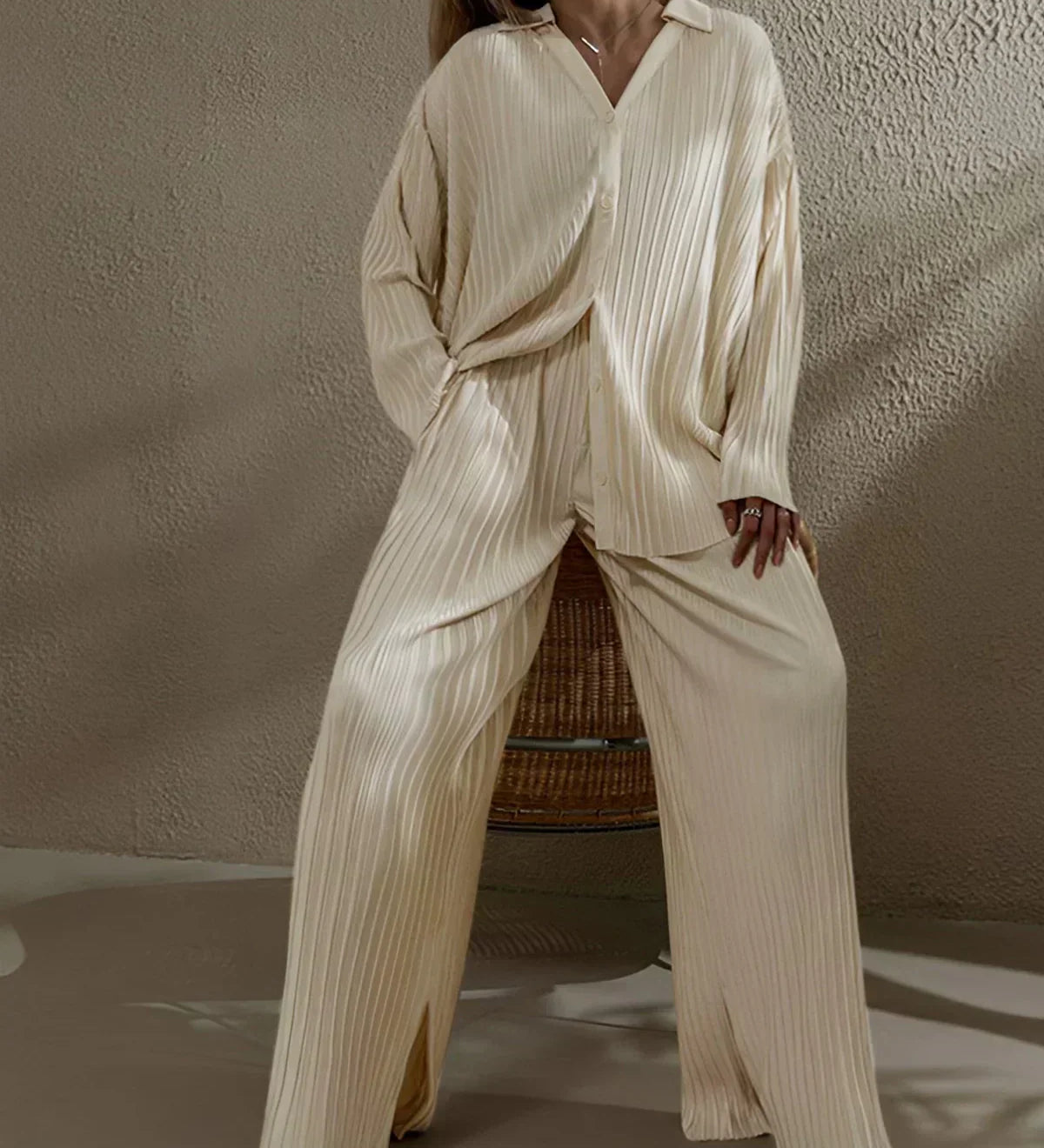 Beige pinstripe oversized pant set with V-neck top and wide-leg trousers with pockets