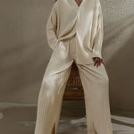 Beige pinstripe oversized pant set with V-neck top and wide-leg trousers with pockets