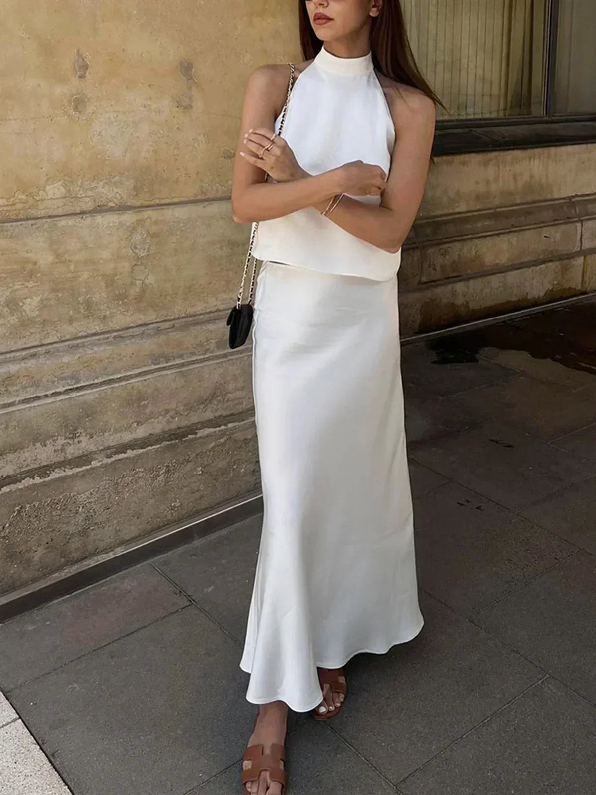 White satin sleeveless crop top and high-waist long maxi skirt