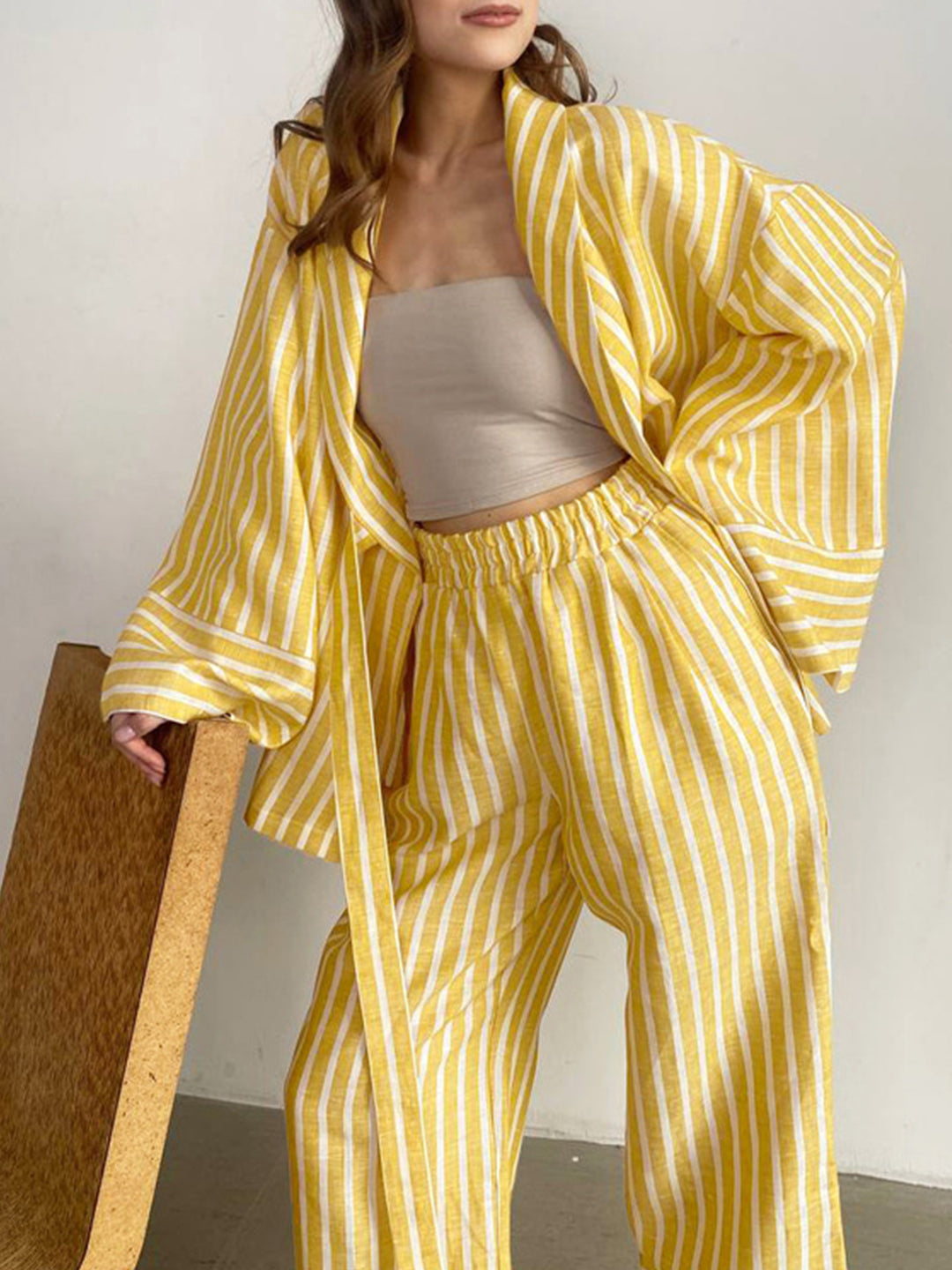 Yellow striped wrap top and high-waist drawstring wide-leg pants