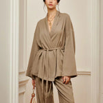 Women’s khaki wrap blouse and wide-leg pants set with waist belt tie, front view