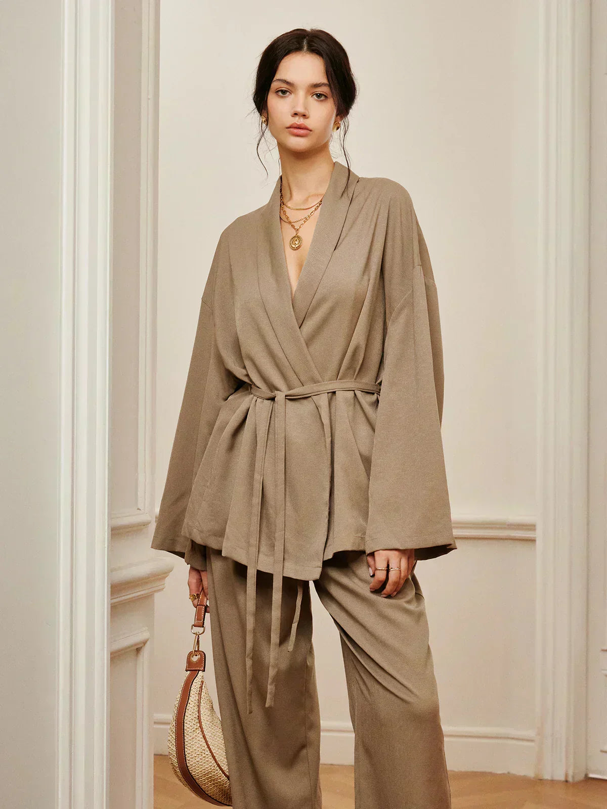 Women’s khaki wrap blouse and wide-leg pants set with waist belt tie, front view