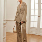 Women’s khaki wrap top and wide-leg pants with waist belt tie, side view