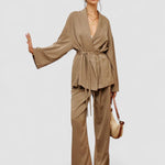 Women’s khaki wrap blouse and wide-leg pants set with waist belt ties