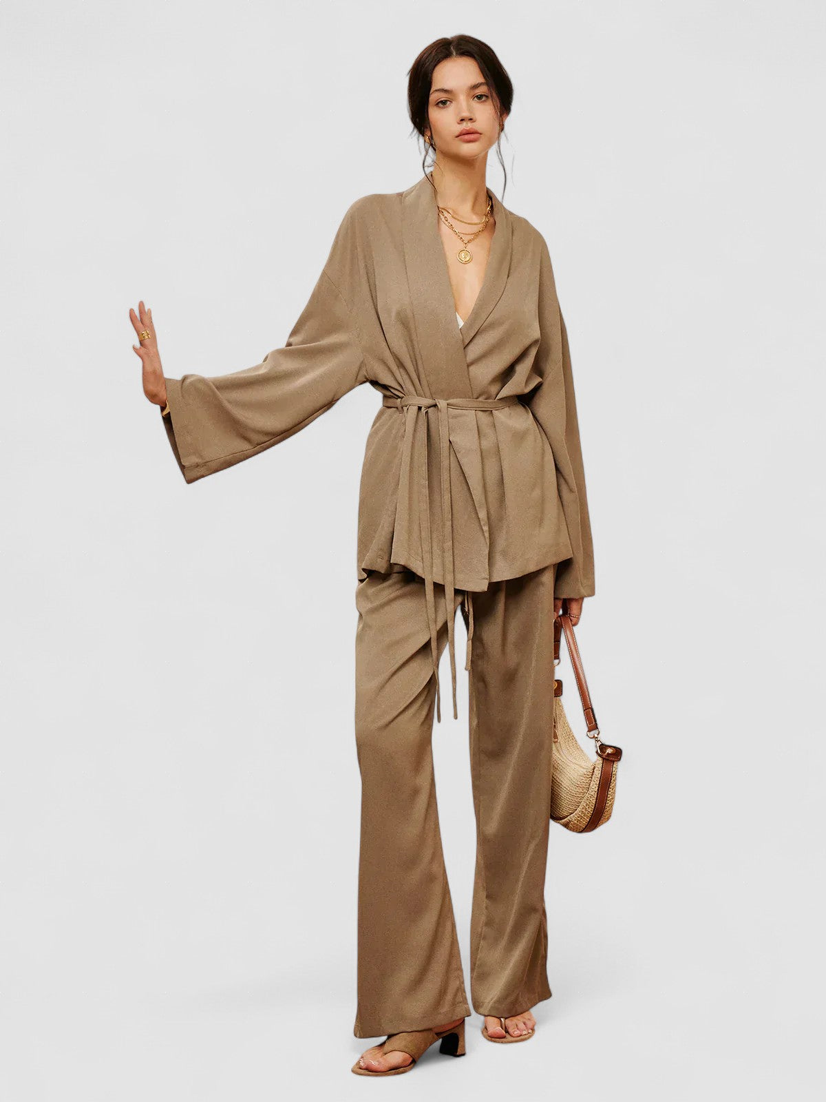 Women’s khaki wrap blouse and wide-leg pants set with waist belt ties