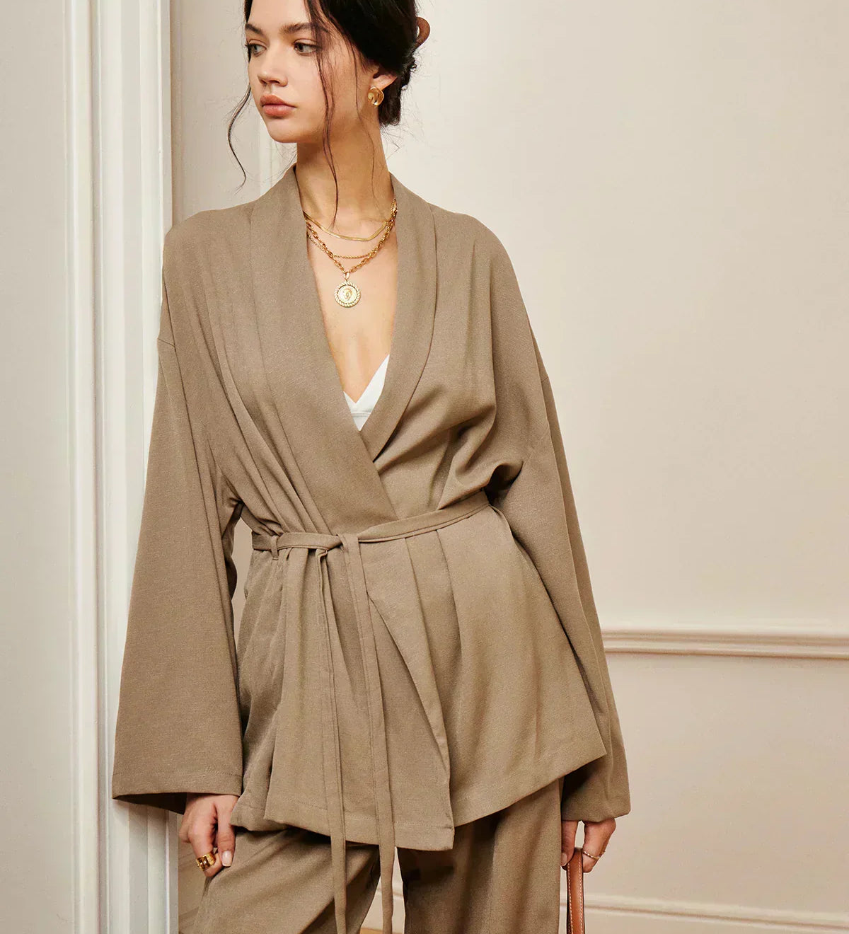Women’s khaki wrap blouse and wide-leg trousers set with waist belt tie