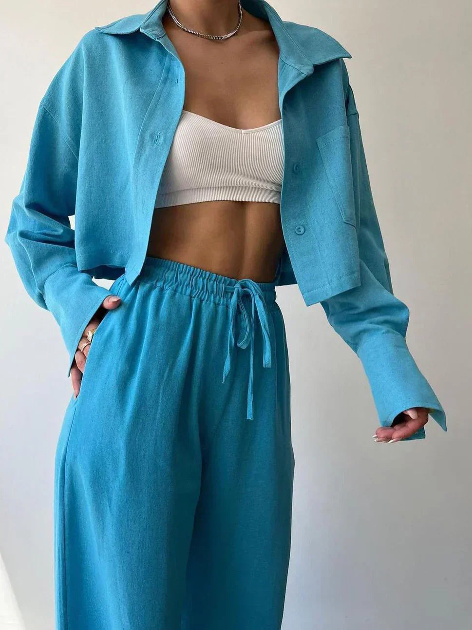 Teal-blue collared button-up shirt and matching drawstring waist pants set