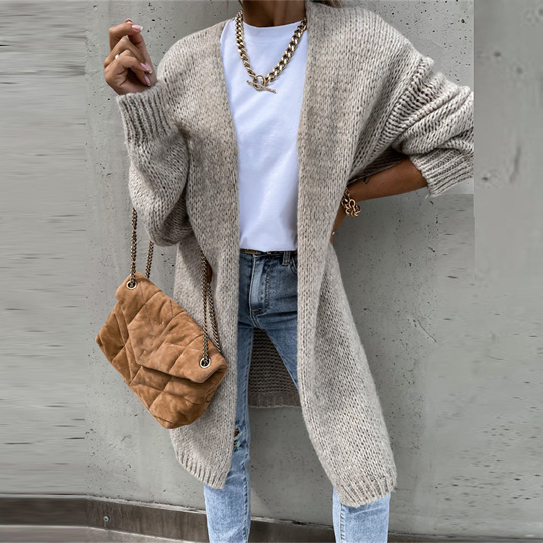 Long taupe knit cardigan with open front, textured knit sleeves, ribbed cuffs and hem.