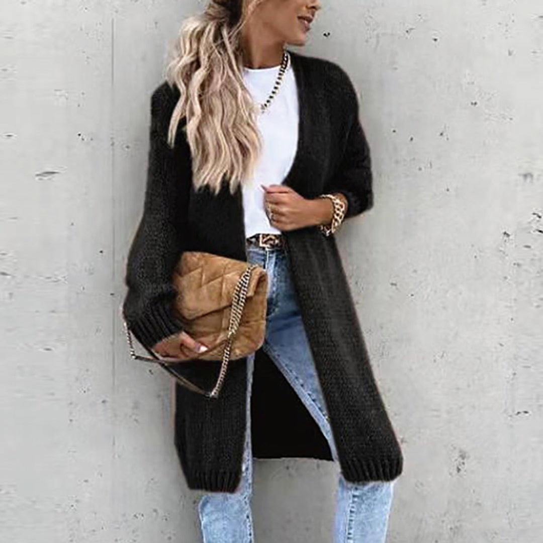 Long black knit cardigan with open front and ribbed cuffs, textured sweater fabric.