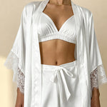 White satin pajama shorts with lace hem and tie waist, worn with matching bra top