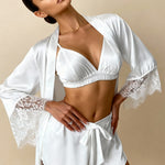 White satin pajama set with lace-trimmed robe sleeves, V-neck bra top, tie-waist shorts