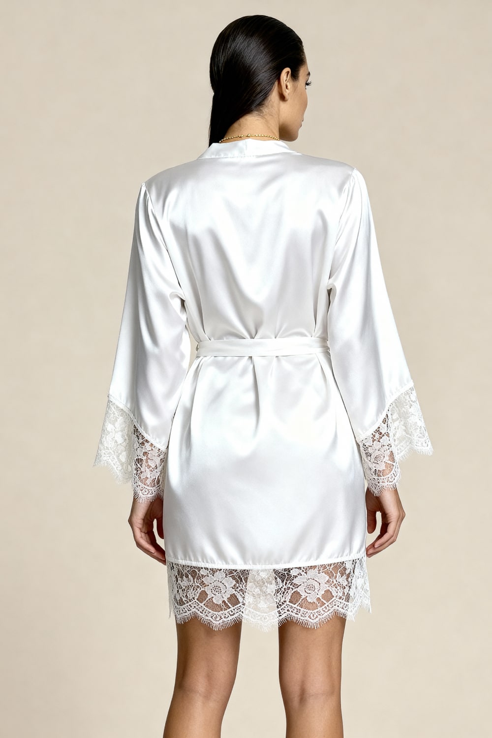 White satin kimono robe with lace-trim cuffs and back tie belt, worn over matching shorts