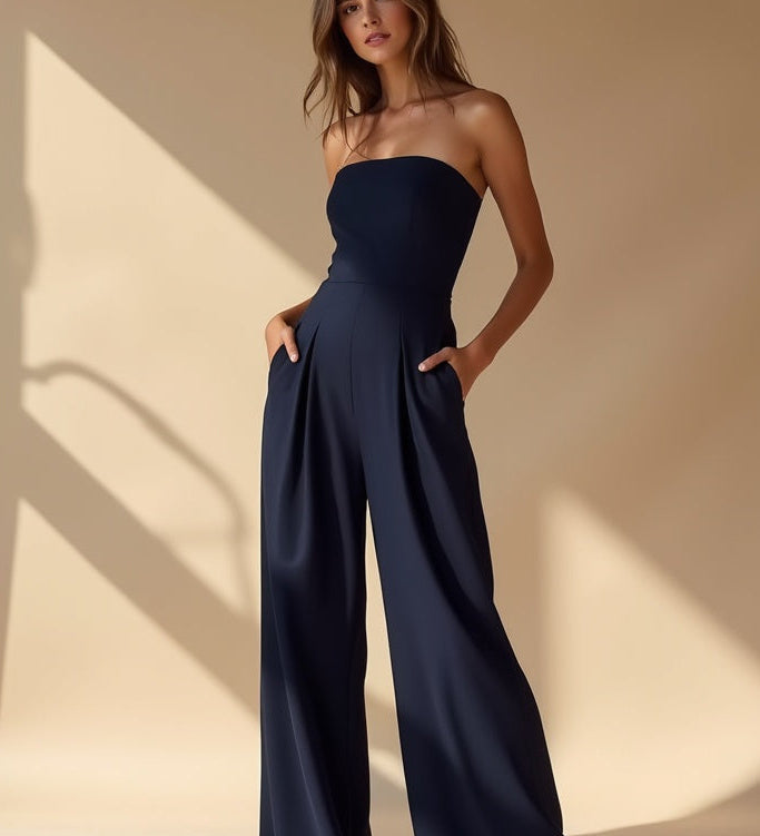 Navy strapless wide-leg jumpsuit with elasticated waist and flowing wide legs